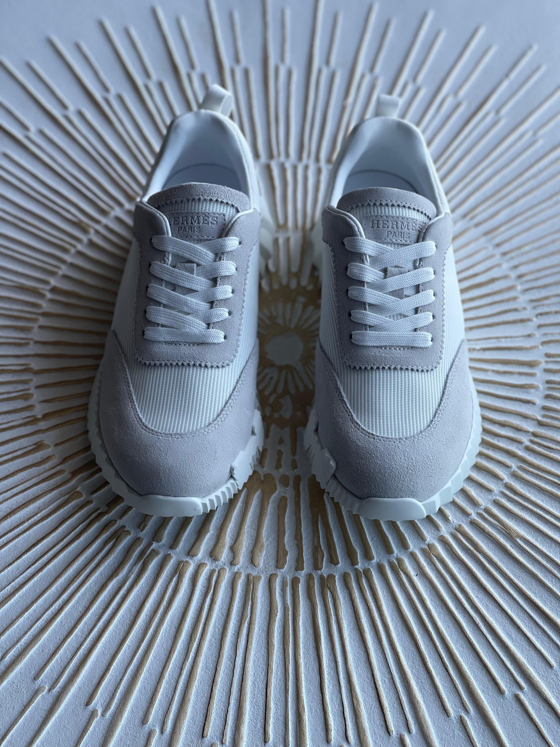 Hermès Paris Bouncing Sneaker in Triple White – All-White Calfskin & Mesh Urban Sneaker.