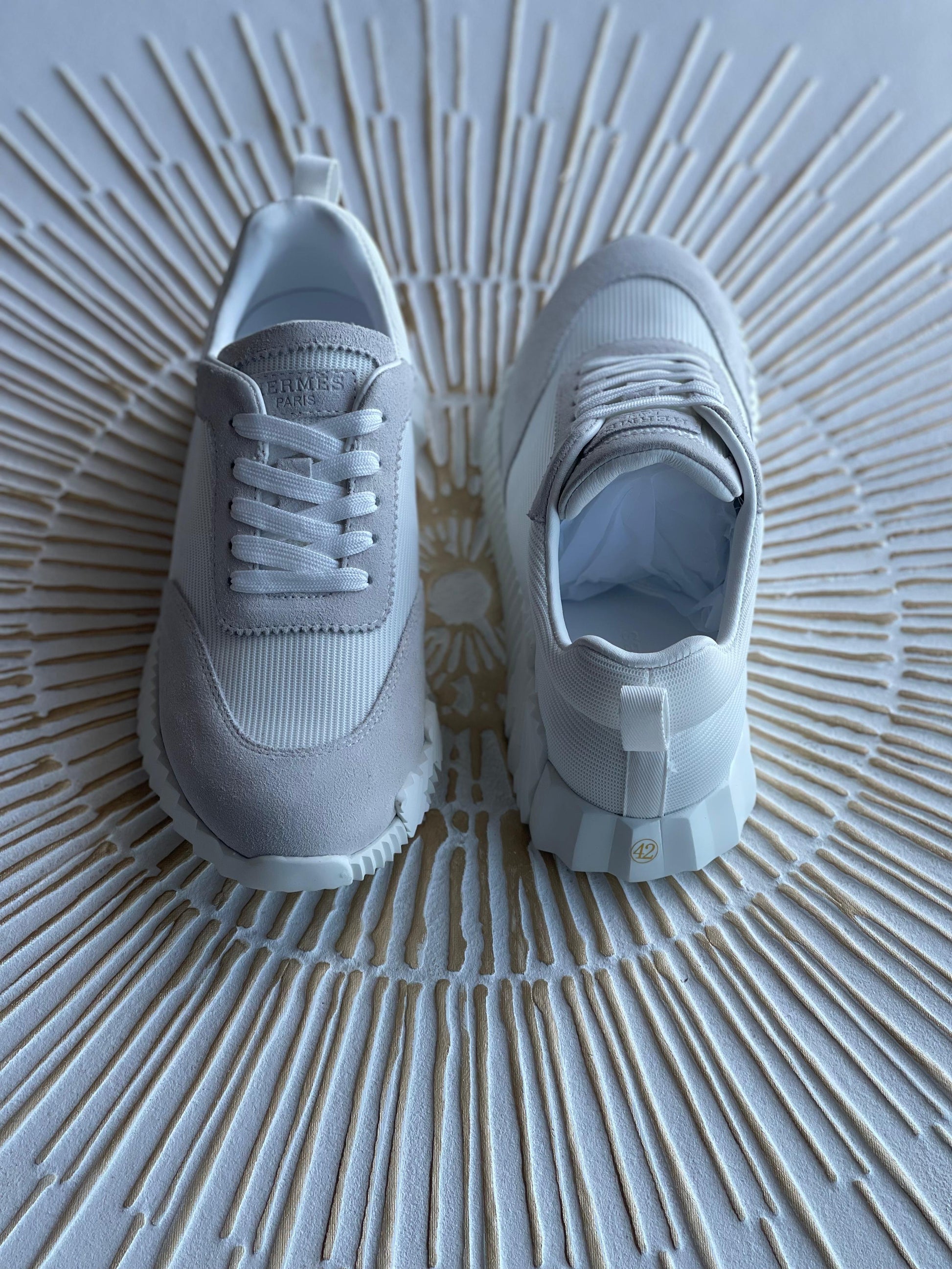 Hermès Paris Bouncing Sneaker in Triple White – All-White Calfskin & Mesh Urban Sneaker.