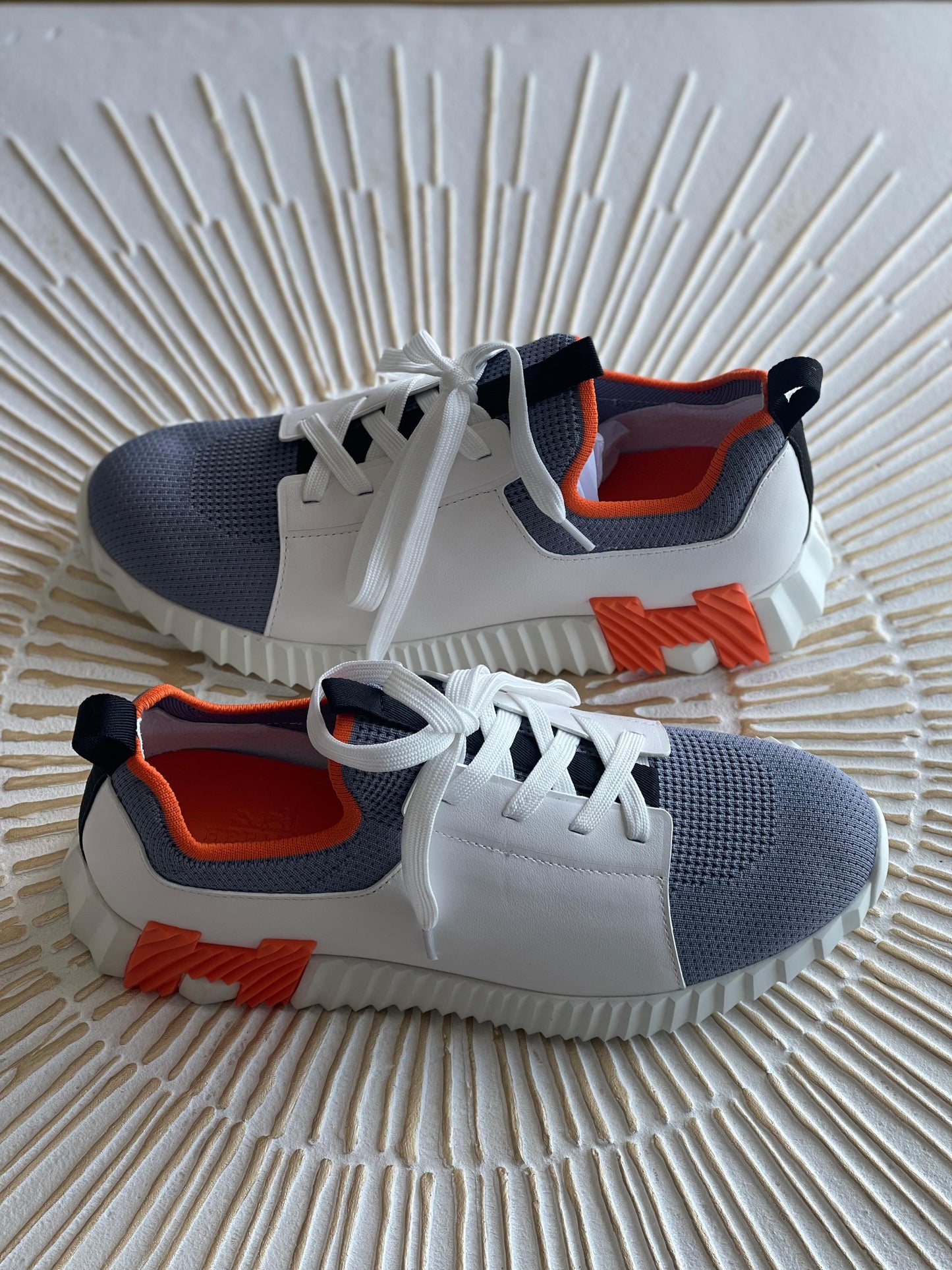 Hermès Depart Slip-On Sneaker – Knit & Calfskin Minimalist Design with Signature Orange Edge