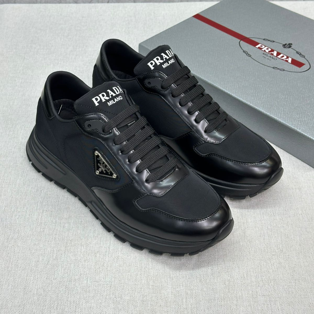 Prada PRAX 01 Sneakers – Black Re-Nylon & Leather